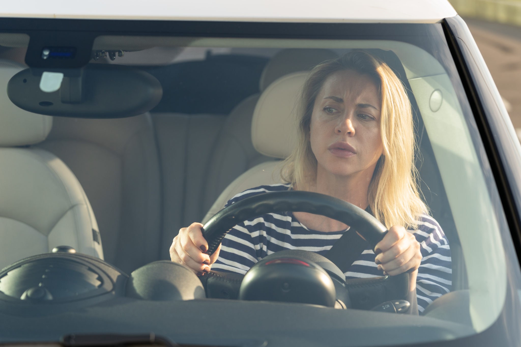 https://autolab.com.co/wp-content/uploads/2022/03/anxious-scared-woman-driver-worried-looking-at-car-2021-09-04-05-02-50-utc-scaled.jpg
