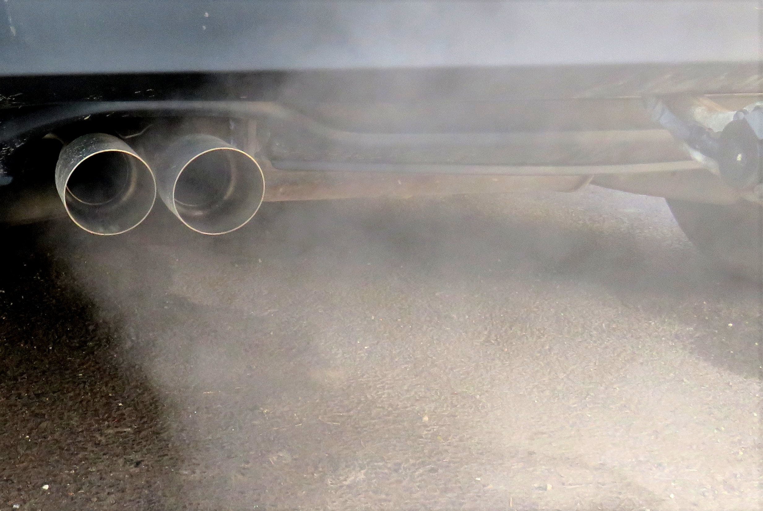 Closeup shot of an auto that exhausts smoke